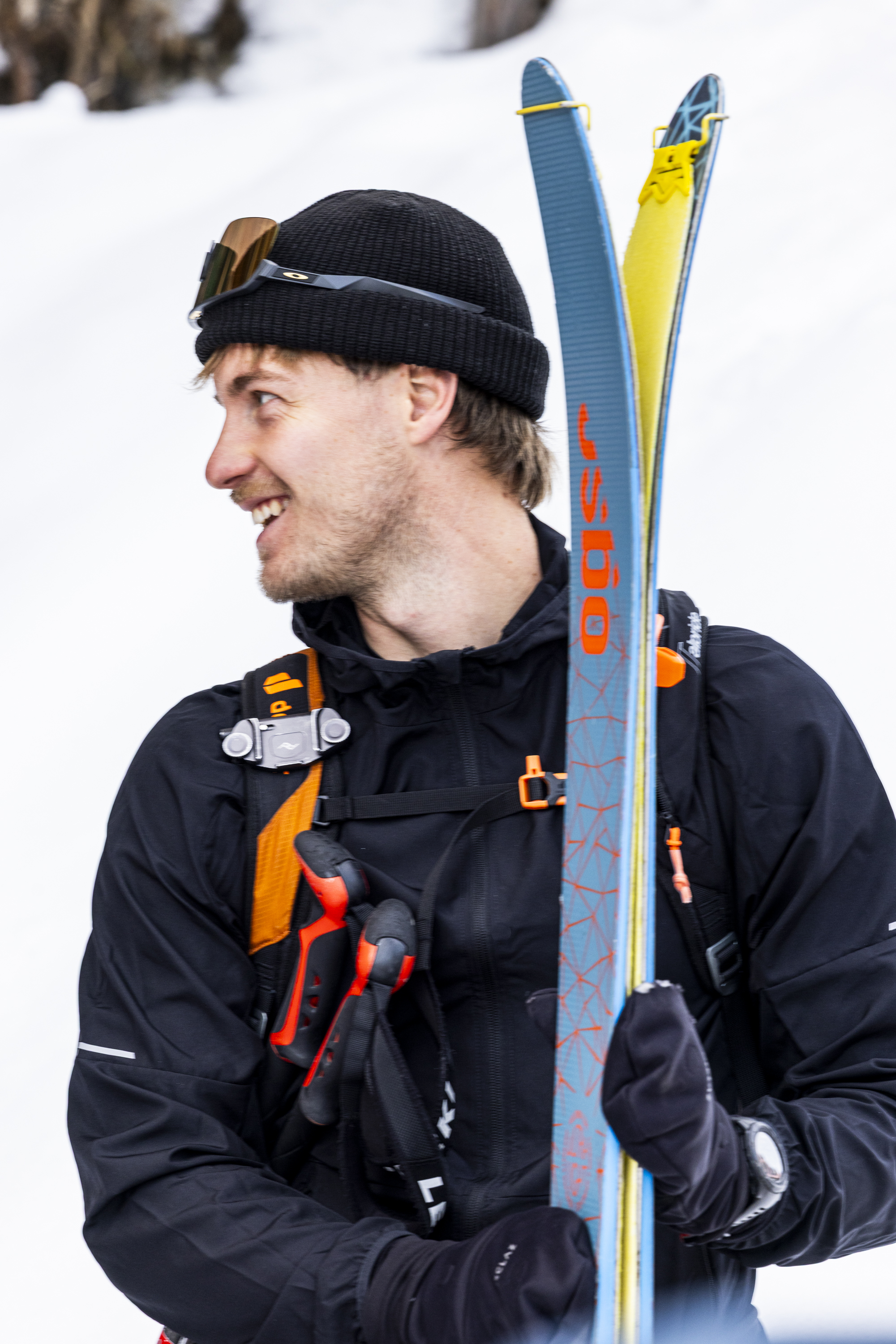 Touring skis, Blue skis, Yellow climbing skins, Winter jacket, Ski equipment