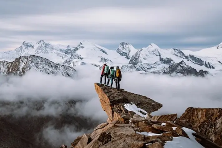 cms-element-headline-double-image-back mountaineers, hikers, mountain, rocky cliff, snow-capped