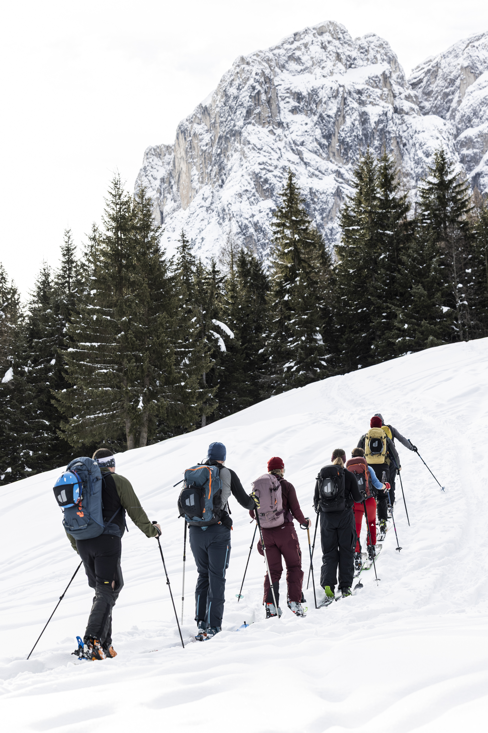 hiking backpack, blue backpack, trekking poles, snow hiking, outdoor gear