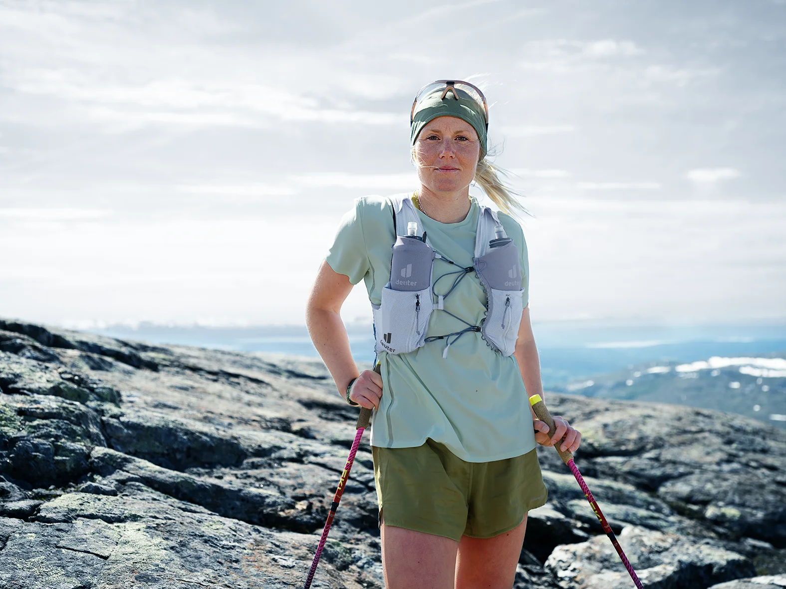 hiking vest, trekking backpack, outdoor gear, mountain terrain, hiking pole