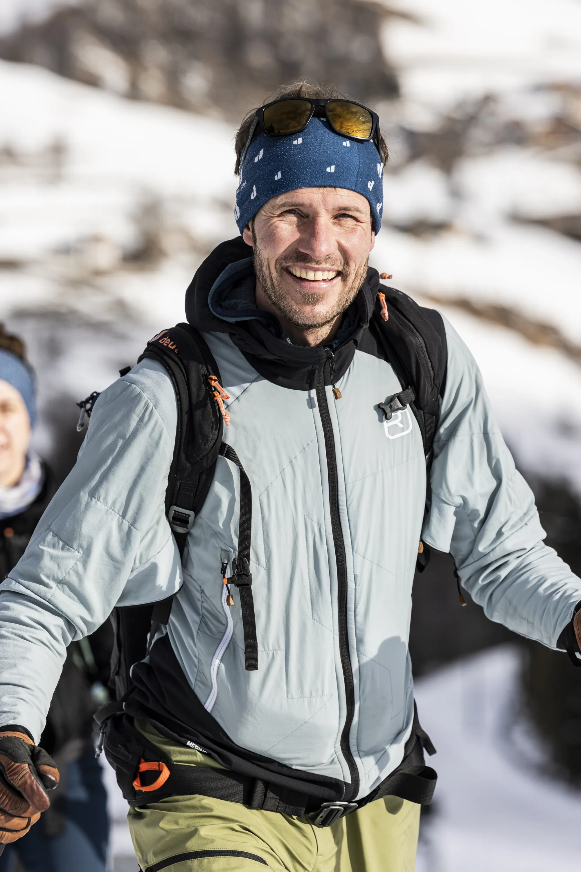 mountain jacket, softshell, headband, sunglasses, backpack