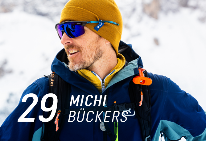 winter jacket, hiking gear, beanie, sunglasses, backpack