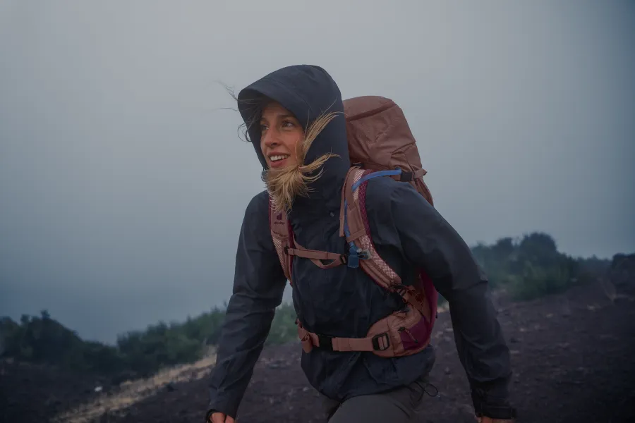 hiker, backpack, outdoor, rain jacket, windy day