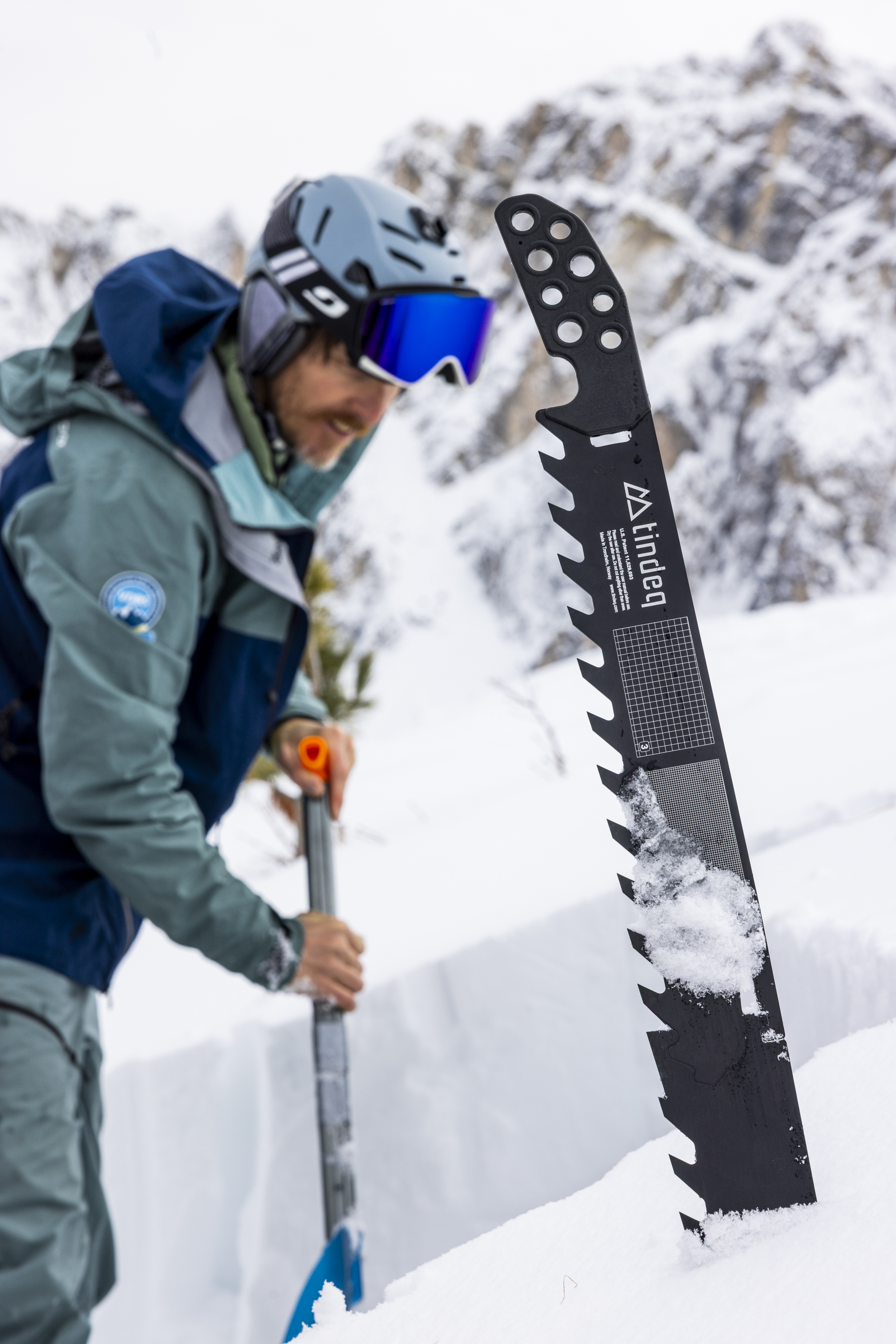 snow saw, avalanche safety tool, black metal, serrated blade, snow depth scale